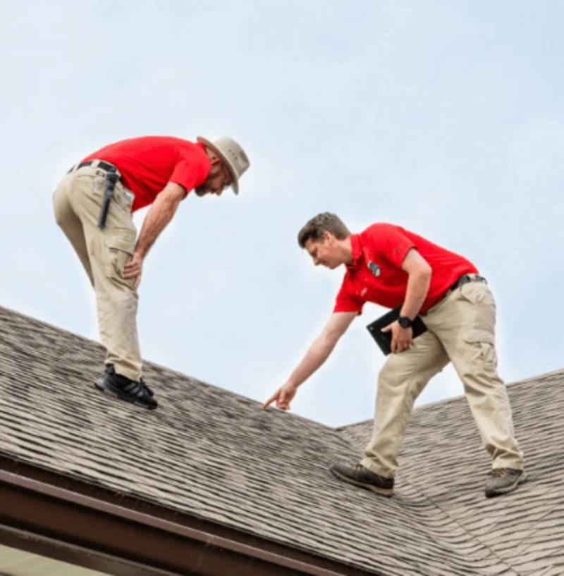 Edd Cobb and Kyle Cobb inspecting a roof at a home inspection Jacksonville FL